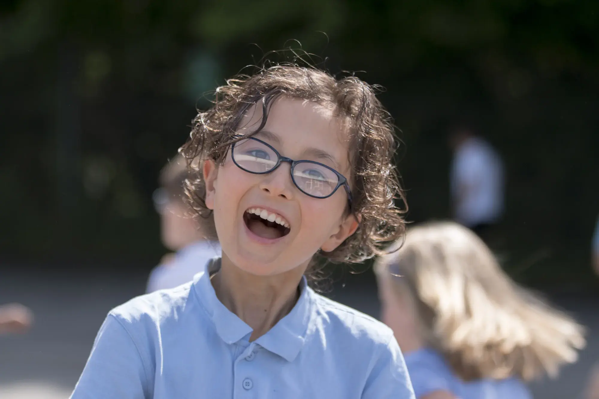 Pupils developing literacy featured in school marketing photography